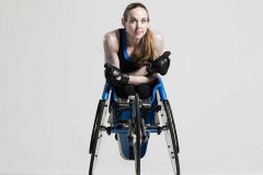 Disabled woman in sports racing wheelchair