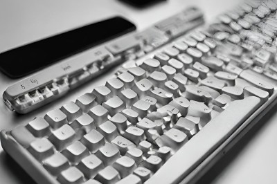 A computer keyboard looks like it has melted. The keys are wonky in places and most of the keys markings on them that do not make sense