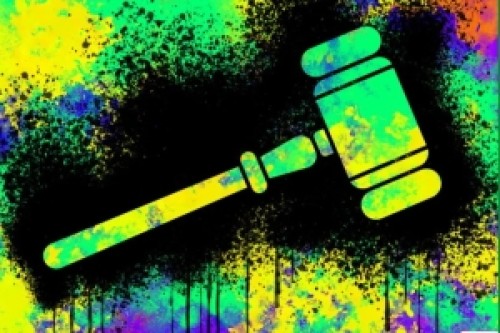 A judge's gavel over a coloured background.  Image credits: Bryce Durbin / Techcrunch