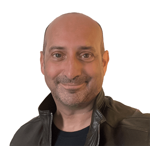 Clive Loseby, a leading advocate for web site accessibility and inclusive design, has brown eyes, no hair, shaped stubble and is smiling